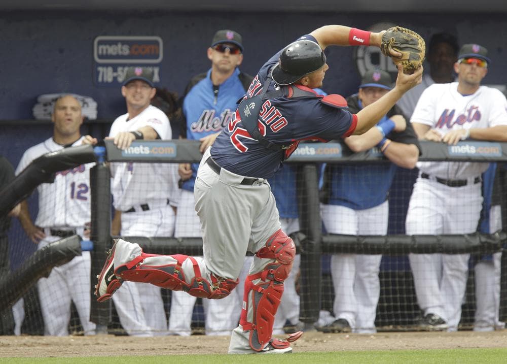 Boston Red Sox catcher Luis Exposito (92) catches a pop-up during a spring training baseball game against the New York Mets on Sunday in Port St. Lucie, Fla. (AP)