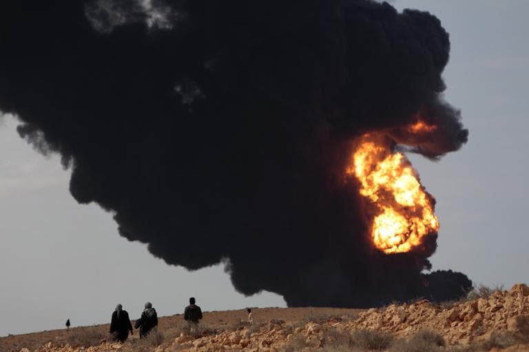 Smoke billows from a fuel storage facility that was attacked during fighting in eastern Libya Wednesday. (AP)