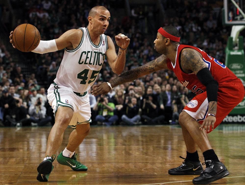 Boston Celtics point guard Carlos Arroyo (45) drives against Los Angeles Clippers guard Mo Williams during the second half of the game in Boston on Wednesday. The Clippers won 108-103. (AP)