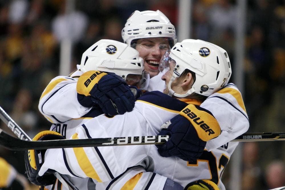 Buffalo Sabres' Brad Boyes, right, celebrates his game-winning goal with teammates Andrej Sekera, left, of Slovakia, and Nathan Gerbe, center, in overtime during the game on Thursday in Boston. The Sabres won 4-3. (AP)