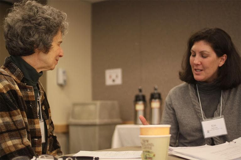 Ellen Westheimer, left, and Kim Agricola discuss end-of-life issues during a Chronic Care Community Corps seminar in Newton. (Kirk Carapezza for WBUR)