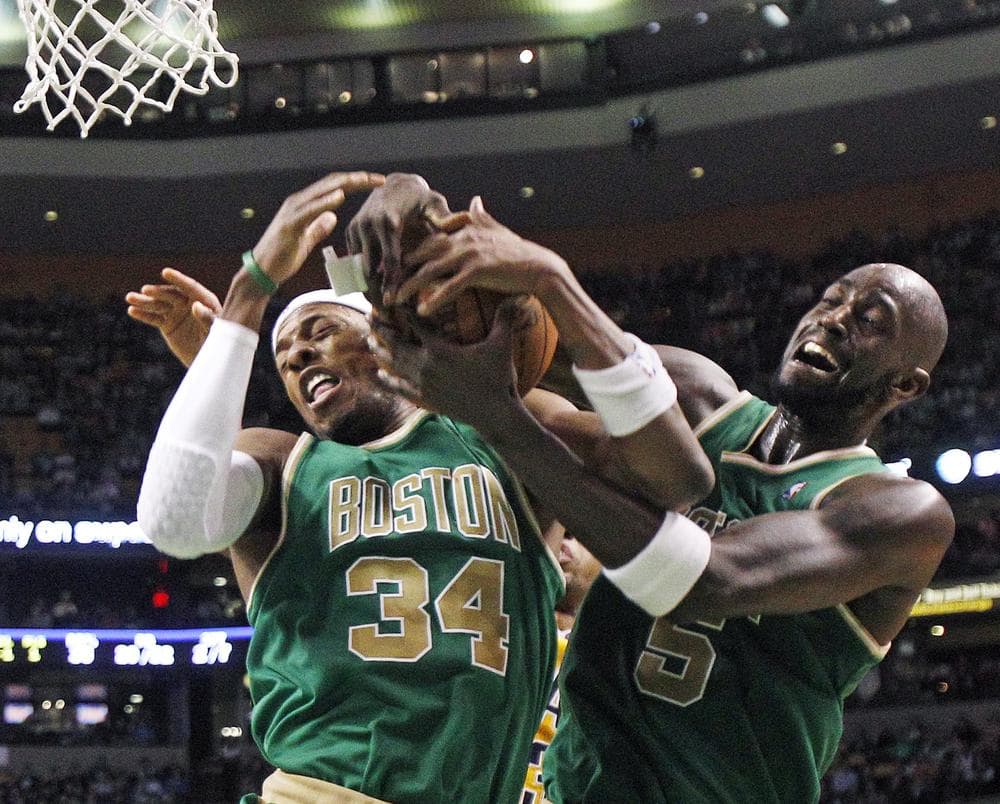 Boston Celtics forwards Paul Pierce (34) and Kevin Garnett (5) go for the same rebound during the second half of the game against the Indiana Pacers in Boston on Wednesday. The Celtics won 92-80. (AP)