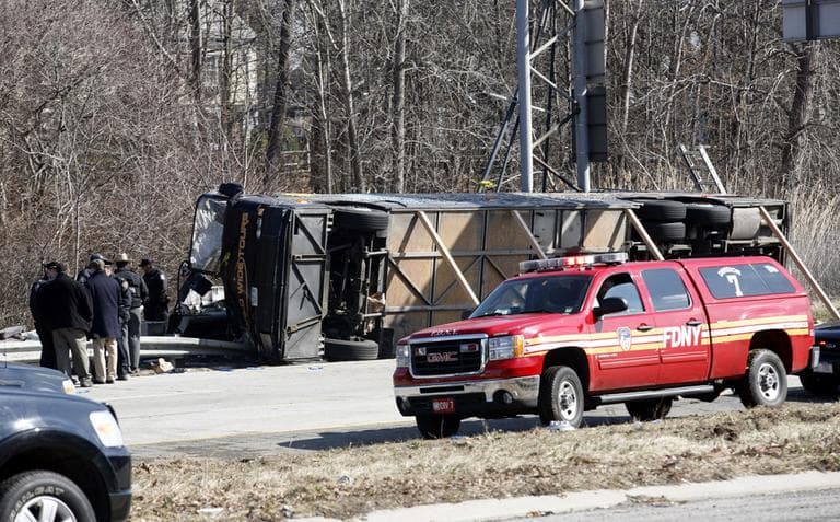At least 13 people died when a bus, returning to New York from a casino in Connecticut, flipped onto its side and was sliced in half by the support pole for a large sign. (AP)