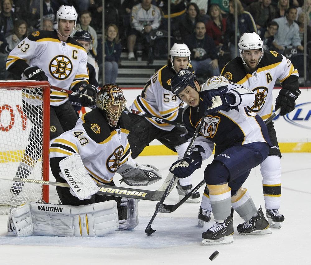 Nashville Predators right wing Jordin Tootoo, front left, chases a rebound after Boston Bruins goalie Tuukka Rask (40), of Finland, blocked a shot in the third period of an NHL hockey game on Thursday in Nashville, Tenn. (AP)
