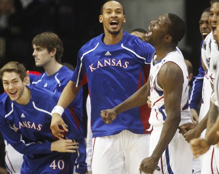 Kansas players including Jordan Juenemann, left, Travis Releford, center, and Mario Little, react to action against Boston University during the Southwest Regional NCAA tournament second round college basketball game, Friday. (AP)