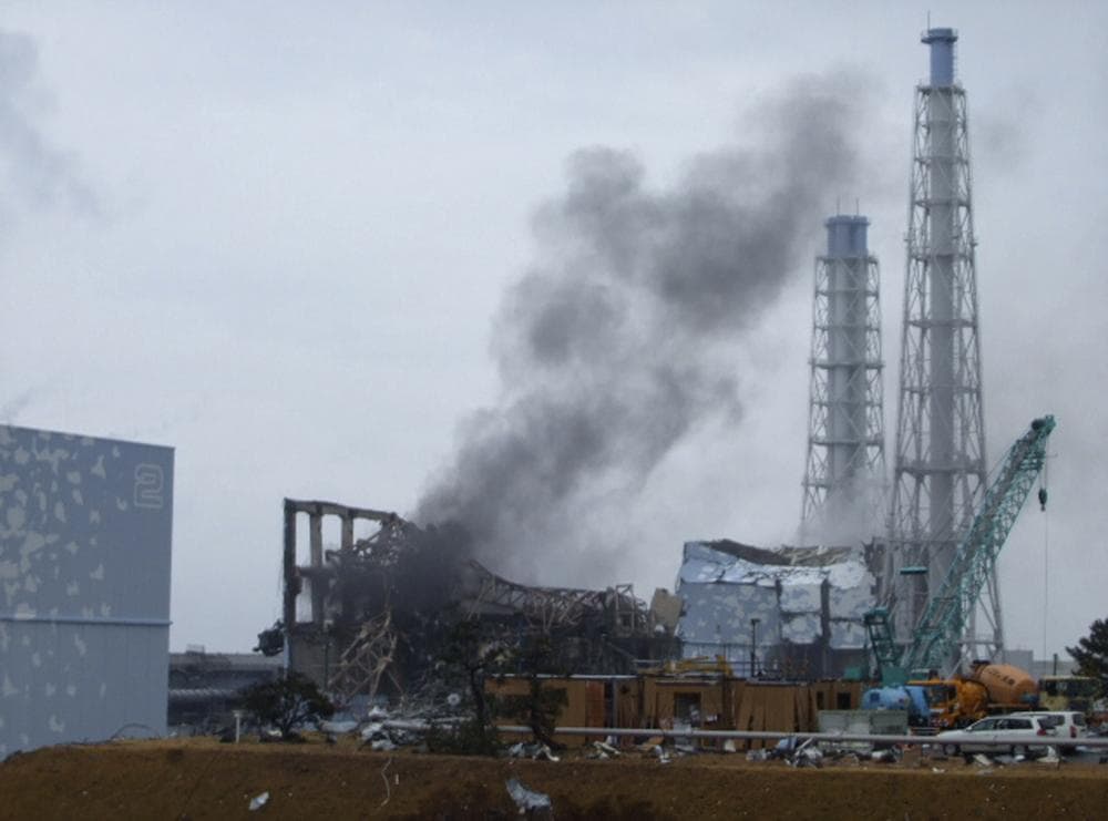 In this photo released by Tokyo Electric Power Co. (TEPCO), gray smoke rises from Unit 3 of the tsunami-stricken Fukushima Dai-ichi nuclear power plant in Okumamachi, Fukushima Prefecture, Japan. (AP) 