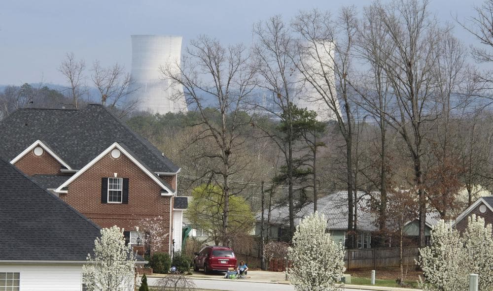 The cooling towers at the Tennessee Valley Authority's Sequoyah Nuclear Plant rise above the trees near a residential neighborhood in Soddy-Daisy, Tenn. (AP)