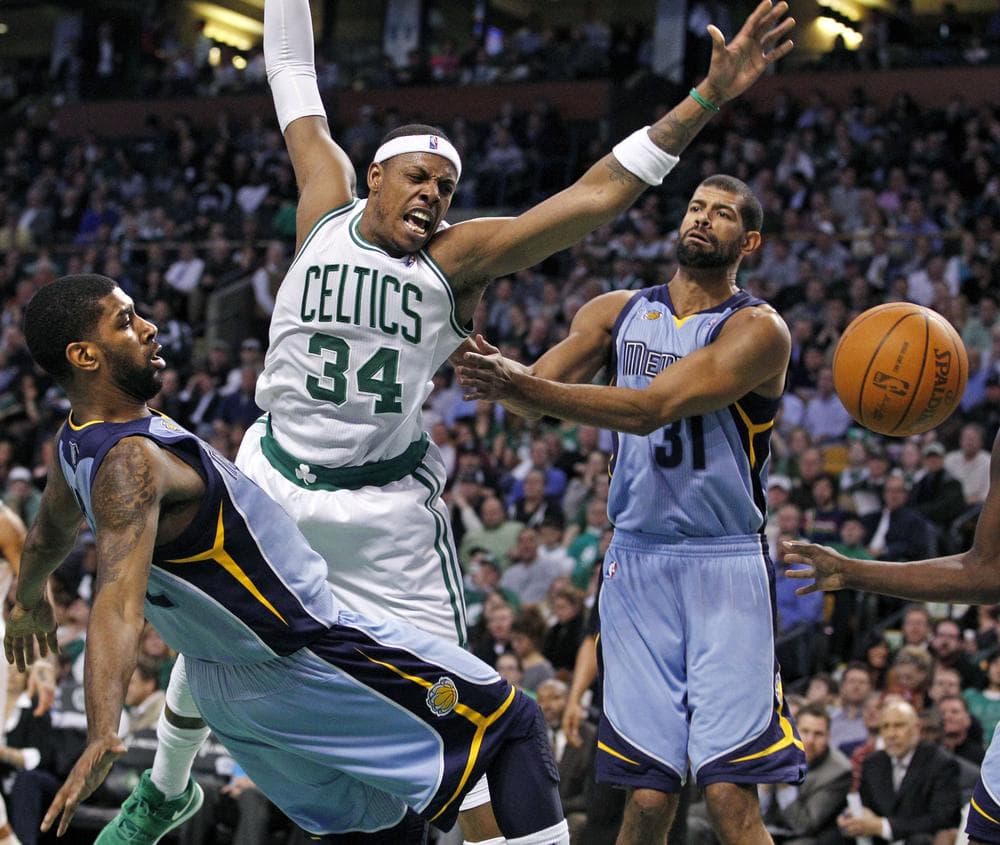 Boston Celtics forward Paul Pierce (34) has the ball knocked away as he drives against Memphis Grizzlies guard O.J. Mayo, left, and forward Shane Battier (31) during the first quarter of the game in Boston on Wednesday. (AP)