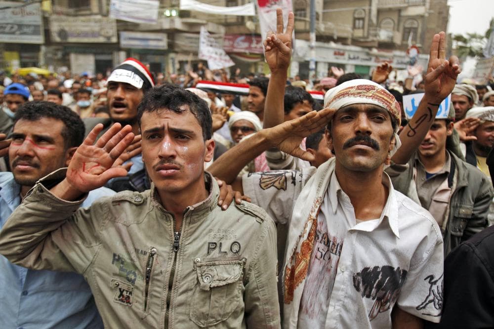 Anti-government protesters salute during a demonstration demanding the resignation of Yemeni President Ali Abdullah Saleh, in Sanaa,Yemen. (AP)