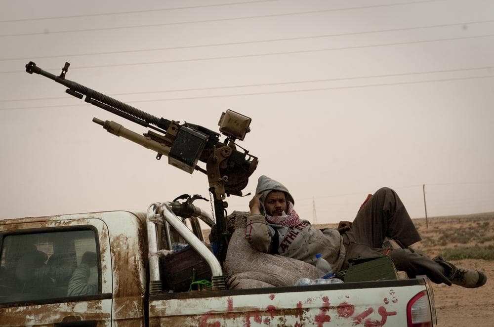 Libyan rebels retreat from the frontline outside of Ras Lanouf, 250 km east of Sirte, central Libya. (AP)