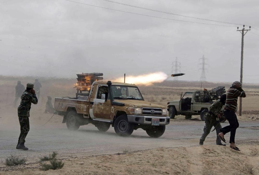 Libyan rebels fire rockets at troops loyal to Libyan leader Moammar Gadhafi on the road between Ajdabiya and Brega, Libya. (AP)