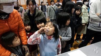 Children in Kawamata, Japan, take potassium iodide