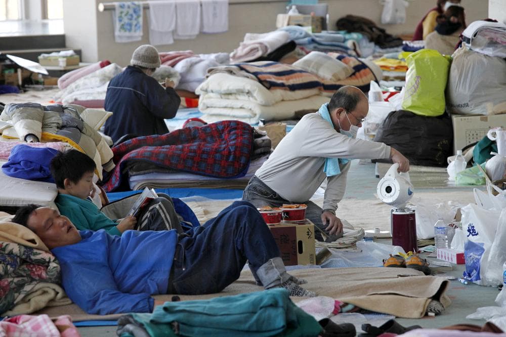 Survivors take rest at a shelter in the tsunami-destroyed town of Sendai, Miyagi Prefecture, northern Japan. (AP)