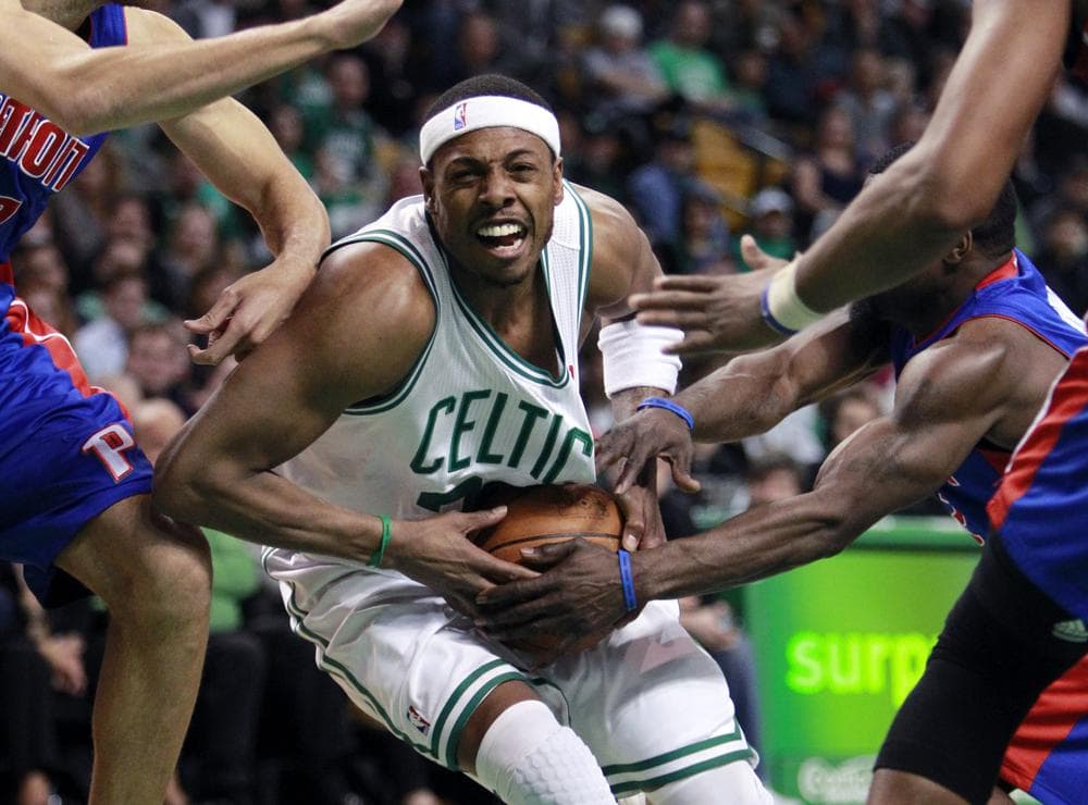 Boston Celtics' Paul Pierce, center, runs into traffic against the Detroit Pistons in the basketball game on Sunday in Boston. The Celtics won 101-90. (AP)