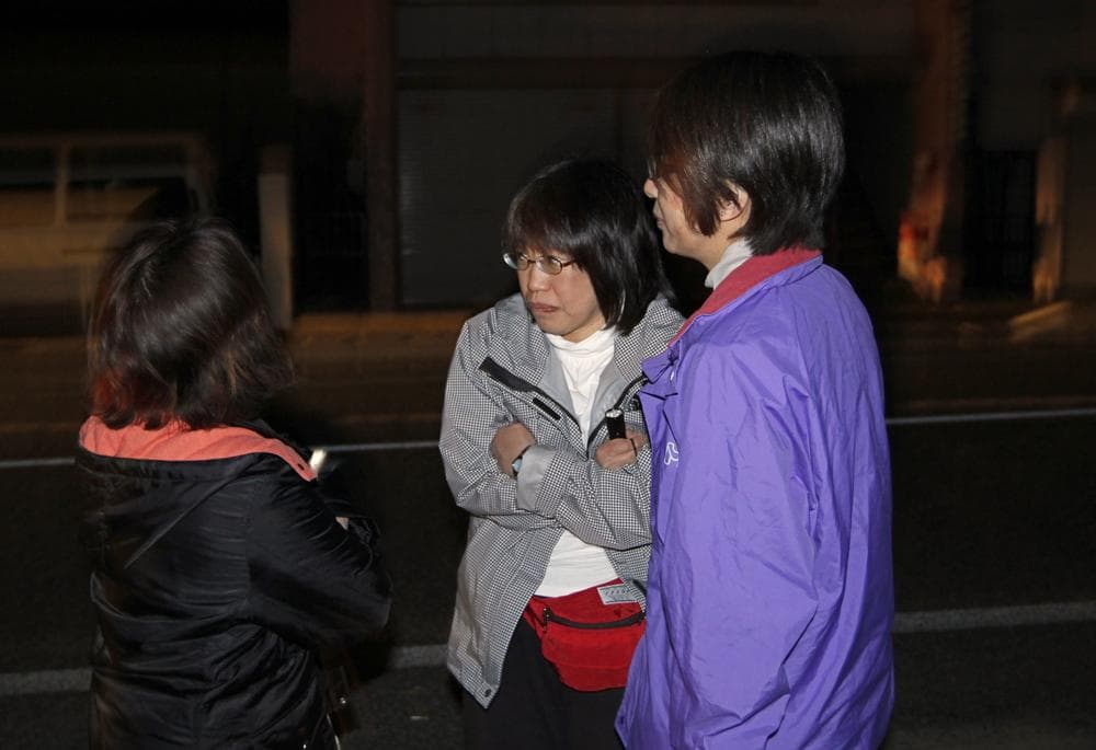 People react in the street after a strong aftershock in Ishinomaki, Iwate Prefecture, northern Japan, Friday, April 8, 2011. (AP)