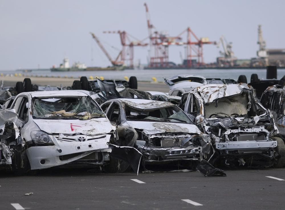 In this March 28, 2011 file photo, new vehicles damaged by the March 11 tsunami waters sit lined in a Toyota parking lot at Sendai port, Miyagi Prefecture, northeastern Japan. A shortage of auto parts and other components after Japan's earthquake has stirred unease about two pillars of manufacturing: the country's role as a crucial link in the global supply chain and &quot;just in time&quot; production. (AP)