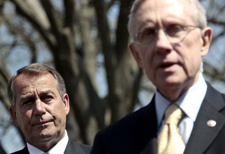 House Speaker John Boehner listens to Senate Majority Leader Harry Reid speak outside the White House in Washington, Thursday. (AP)