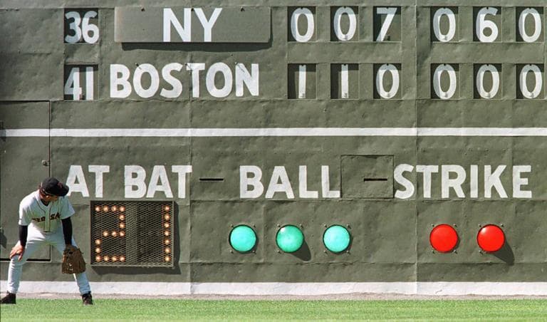 The original Green Monster scoreboard, shown here in 1998, no longer resides at Fenway Park. (AP)
