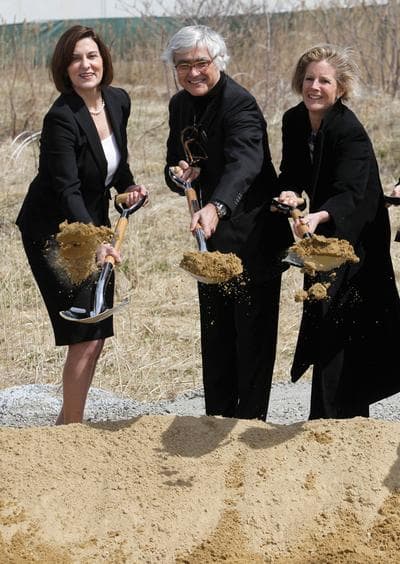 From left, Vicki Kennedy, widow of Sen. Edward M. Kennedy, architect Rafael Vinoly and Kara Kennedy, daughter of the late senator, shovel dirt during groundbreaking ceremonies for the new Edward M. Kennedy Institute for the United States Senate, in Boston. (AP)