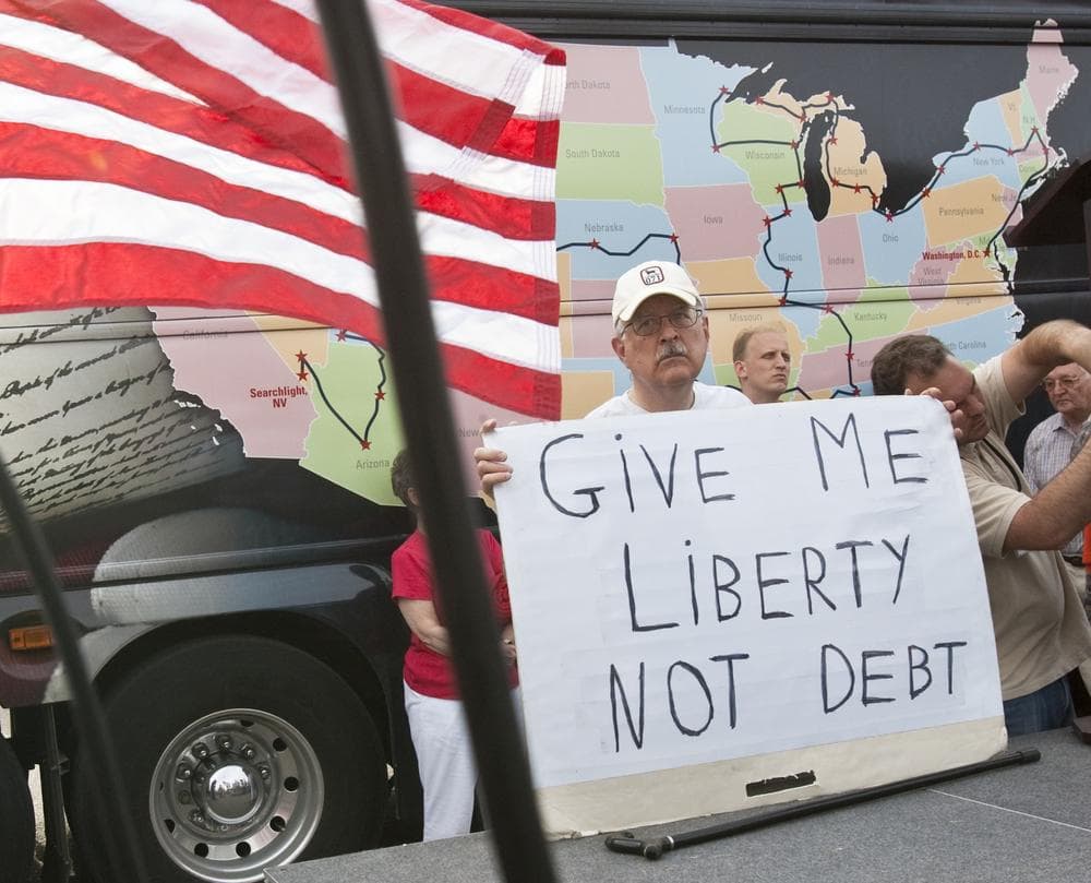 A participant in the Tea Party rally holds a sign in Omaha, Neb. in 2010. (AP)