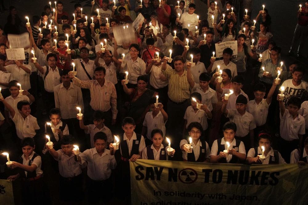 Indians participate in a candle light vigil in Ahmadabad, India, on Monday to protest the country's plans to increase its nuclear power by 600 percent.  (AP)  