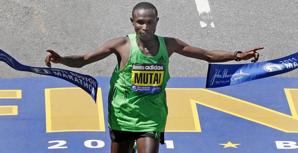 Geoffrey Mutai of Kenya breaks the tape to win the men's division at the finish line of the 115th Boston Marathon in Boston. (AP)
