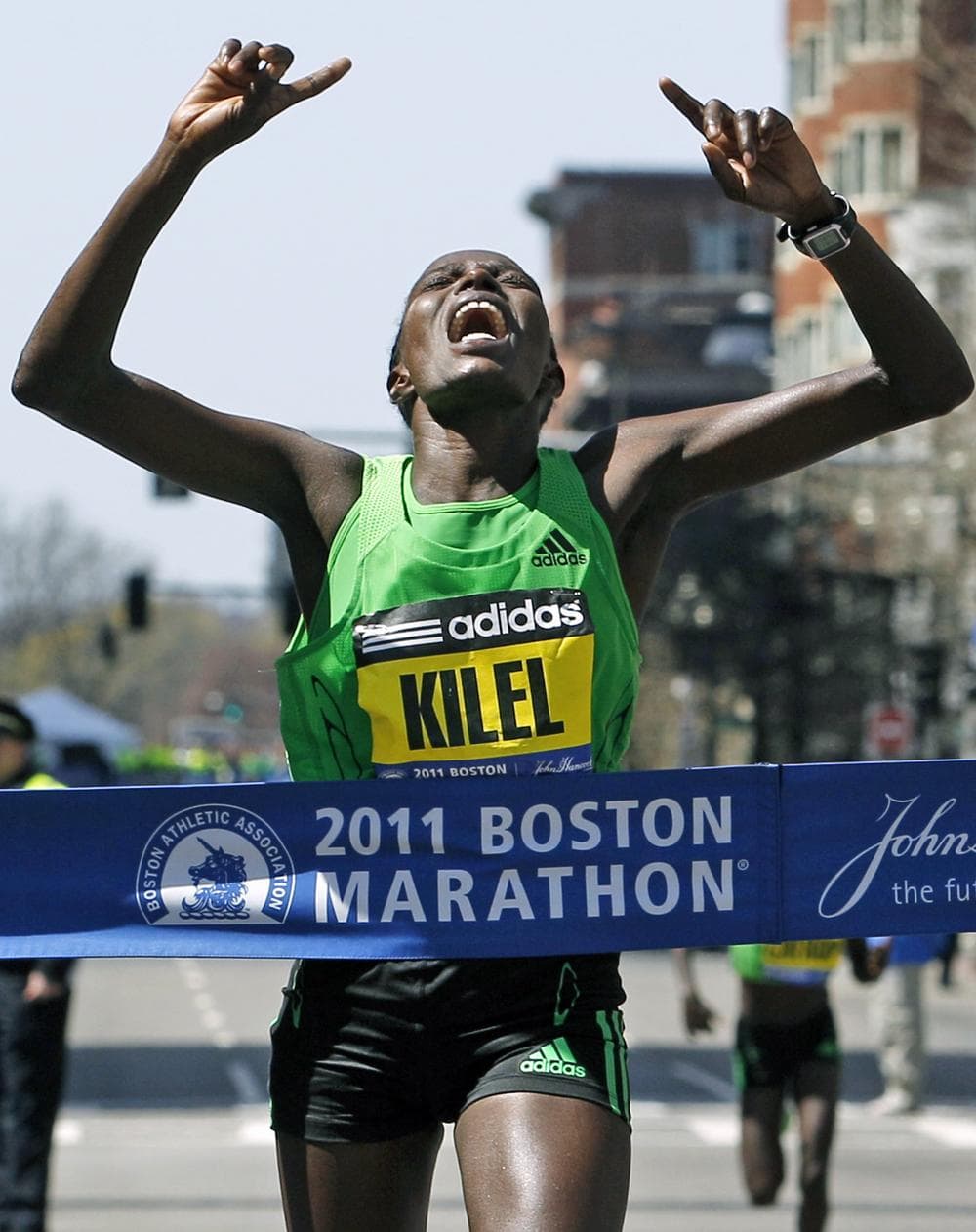 Winner Caroline Kilel of Kenya reacts as she crosses the finish line of the 115th Boston Marathon in Boston Monday. (AP)