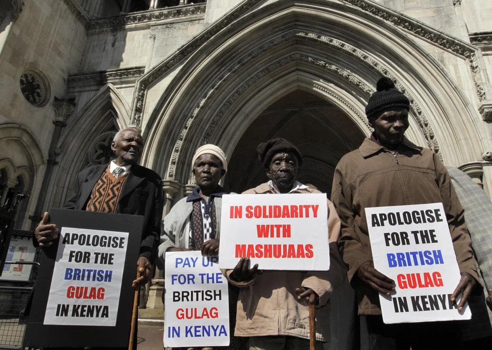 Kenyans (left to right) Wambugu Wa Nyingi, Jane Muthoni Mara, Paulo Nzili and Ndiku Mutua, stand outside the Royal Courts of Justice, in central London. They are taking the British government to court over alleged atrocities in the 1950s in what is now Kenya. (AP)
