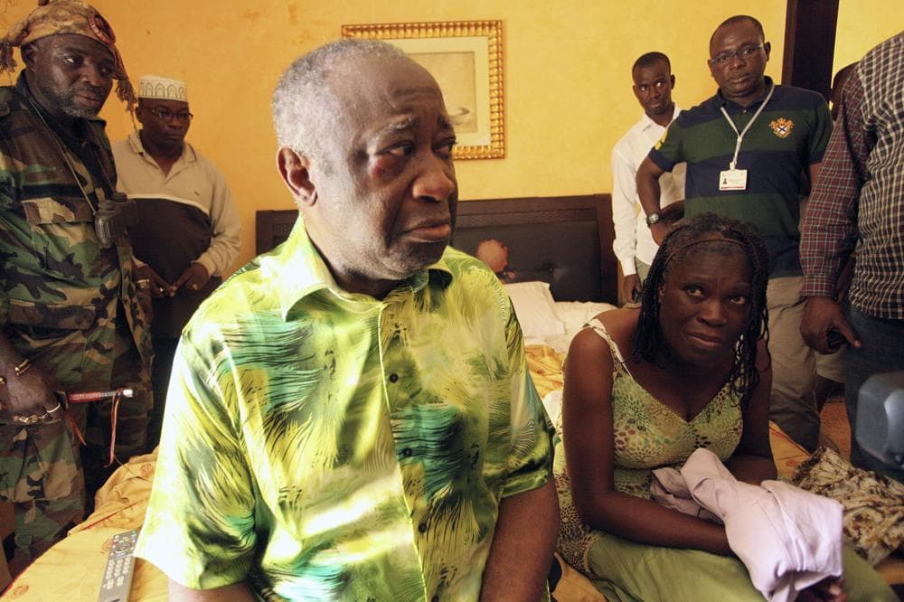 Former Ivorian President Laurent Gbagbo, center, and his wife Simone, are seen in the custody of republican forces loyal to election winner Alassane Ouattara at the Golf Hotel in Abidjan, Ivory Coast, Monday, April 11, 2011. (AP)