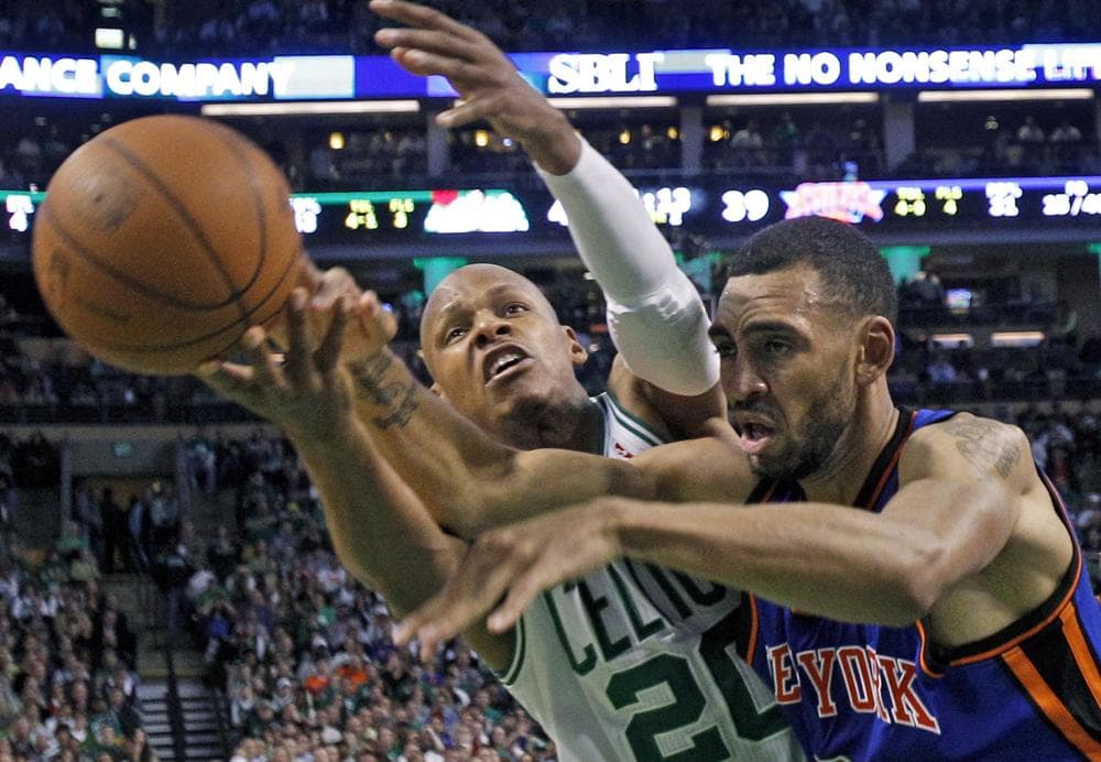 Boston Celtics guard Ray Allen reaches for the ball next to New York Knicks forward Jared Jeffries during the first half of Game 2 of the playoff series in Boston on Tuesday. (AP)