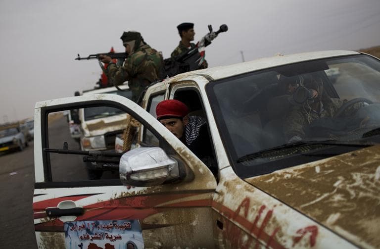 Libyan rebel fighters prepare to engage pro-government forces in the outskirts of Ajdabiya, Libya. (AP)