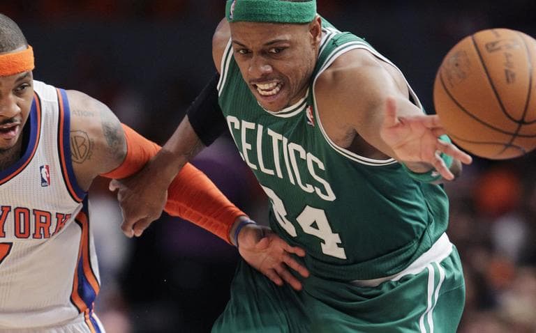 Celtics captain Paul Pierce lunges for the ball ahead of Knicks forward Carmelo Anthony during their playoff game Sunday in New York. (AP)