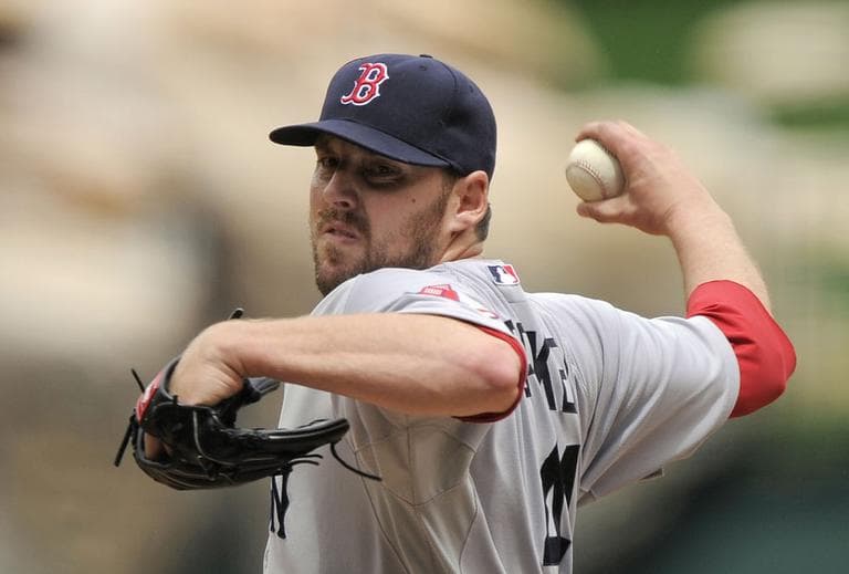 Boston Red Sox starting pitcher John Lackey throws to the plate during the third inning of their game against the Los Angeles Angels on Sunday in Anaheim, Calif. (AP)