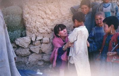 Roberta Gately examining a child at a clinic in Afghanistan. (Courtesy)