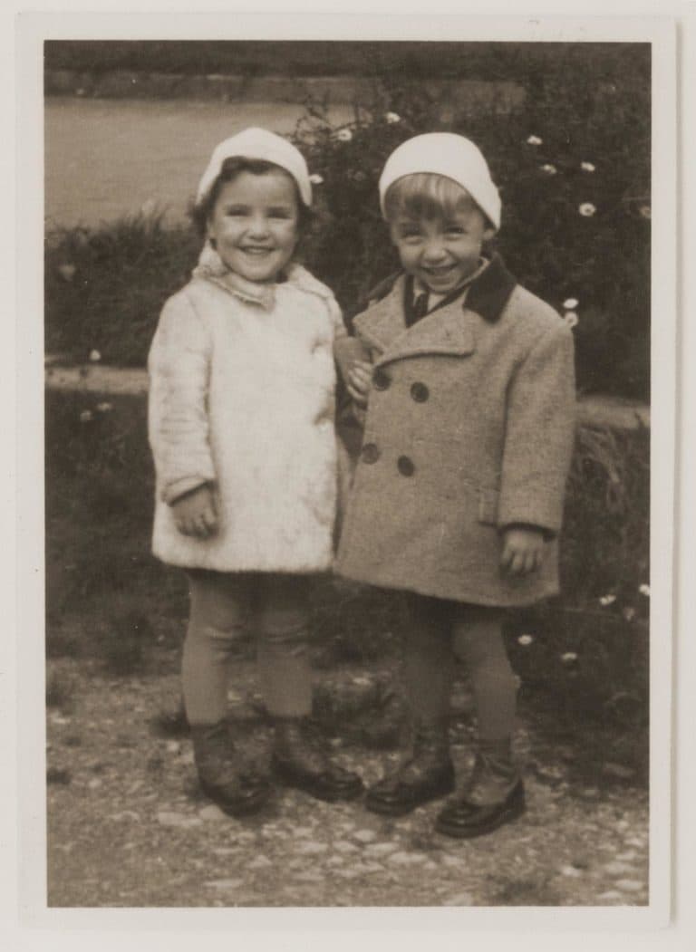 Renata Guttman, left, with her twin brother, Rene, before the war. (Courtesy Irene Hizme)