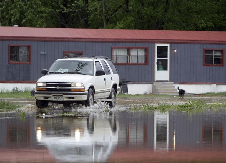 Thousands of southeastern Missouri residents watched helplessly Monday as water from the Black River crept toward their homes after flowing over the levee protecting their town and trapping some who had to be rescued by boat. (AP)