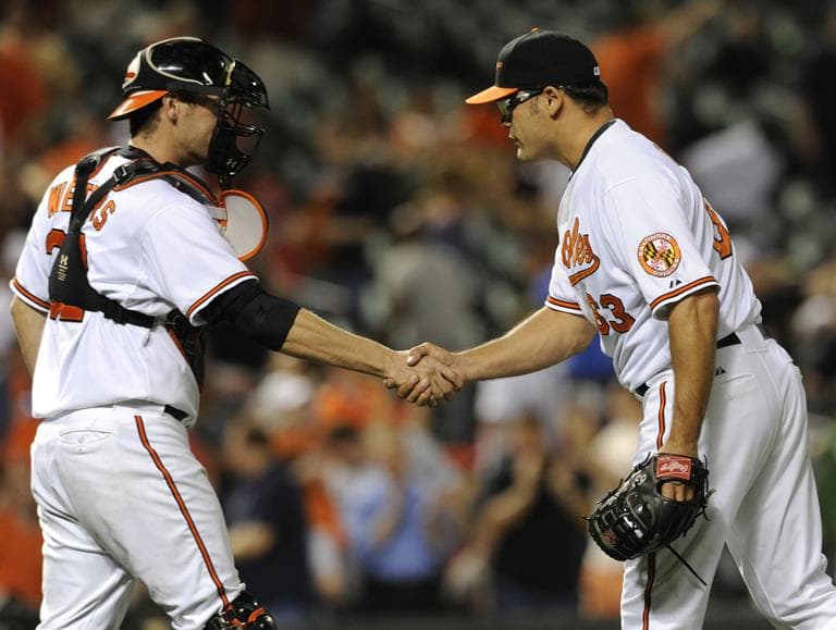 Baltimore Orioles pitcher Kevin Gregg and catcher Matt Wieters celebrate after defeating the Boston Red Sox 4-1 Tuesday. (AP)