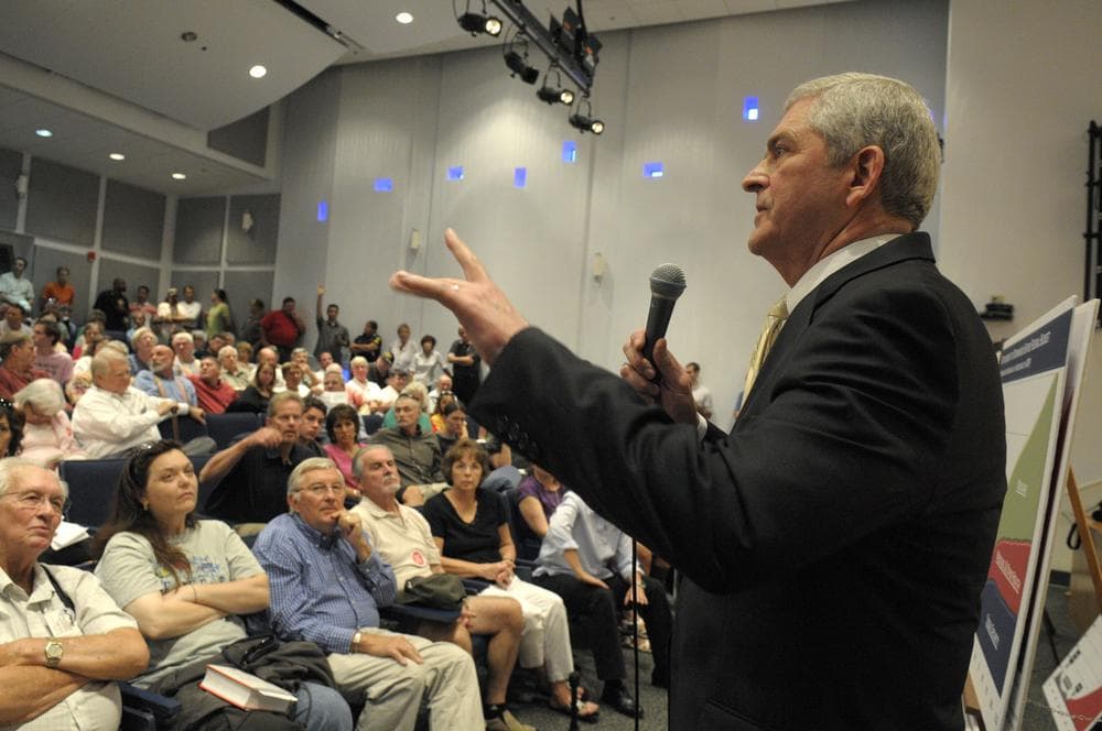 Rep. Daniel Webster, R-Fla., right, answers questions from constituents during a crowded town hall meeting in Orlando, Fla. (AP)