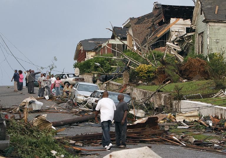 Residents survey the destruction after a tornado hit Pratt City, Ala. just north of downtown Birmingham, Ala., on Wednesday. (AP)
