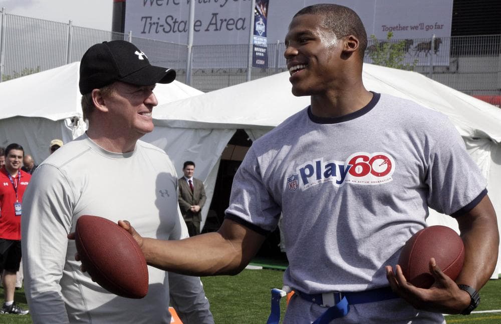 Despite the smiles on the faces of NFL Commissioner Roger Goodell (l) and the top pick of 2011, Cam Newton, the league's labor issues are far from being resolved. (AP)