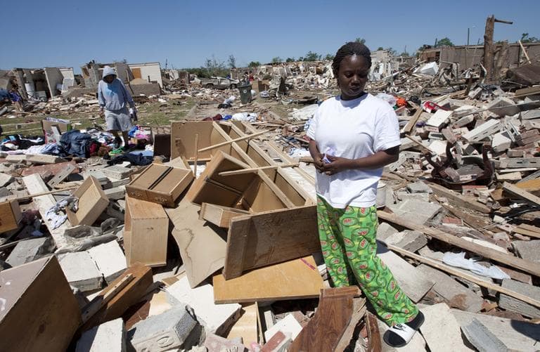 Robbie Thomas cries as she looks through her tornado ravaged home in Tuscaloosa, Ala., Friday. (AP)