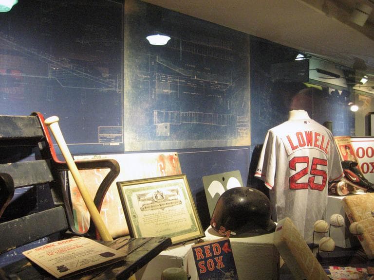 A new display under the Fenway Park grandstand features Red Sox artifacts, including blueprints for the 1934 Green Monster expansion. (Curt Nickisch/WBUR)