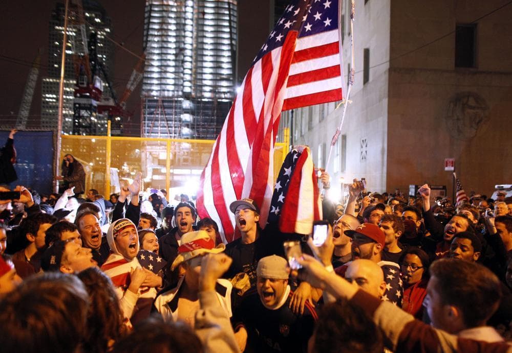 A large, jubilant crowd reacts at the corner of Church and Vesey Streets, adjacent to ground zero in New York City, during the early morning hours on Monday. (AP)