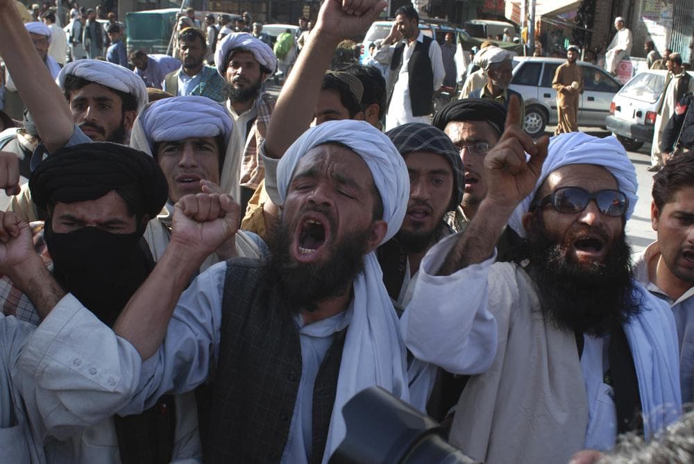 Supporters of Pakistani religious party Jamiat Ulema-e-Islam rally to condemn the killing of Osama bin Laden in Quetta, Pakistan on Monday. (AP)