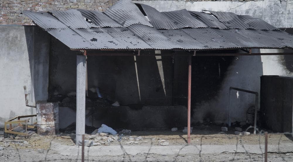 A portion of the compound of a house, where al-Qaida leader Osama bin Laden was caught and killed is seen half burned in Abbottabad, Pakistan. (AP)