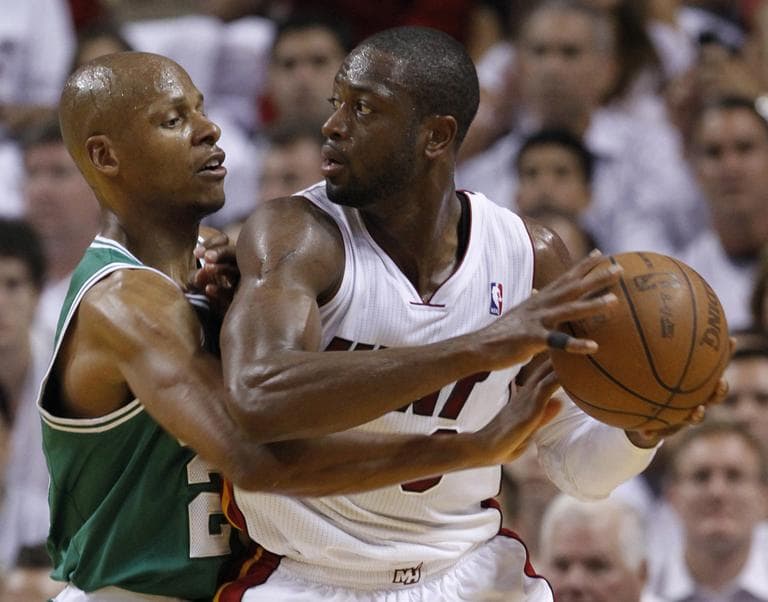 Miami Heat's Dwyane Wade, right, looks for an open teammate past Boston Celtics' Ray Allen during Game 2 of a second-round NBA playoff basketball series, Tuesday. (AP)