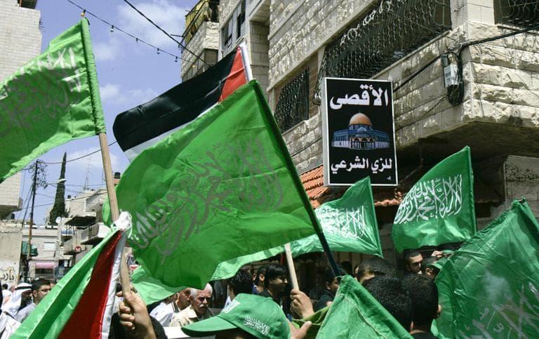 Hamas supporters rally in the West Bank town of Tulkarem, Friday, after rival Palestinian factions Fatah and Hamas signed a landmark reconciliation pact on Wednesday. (AP)