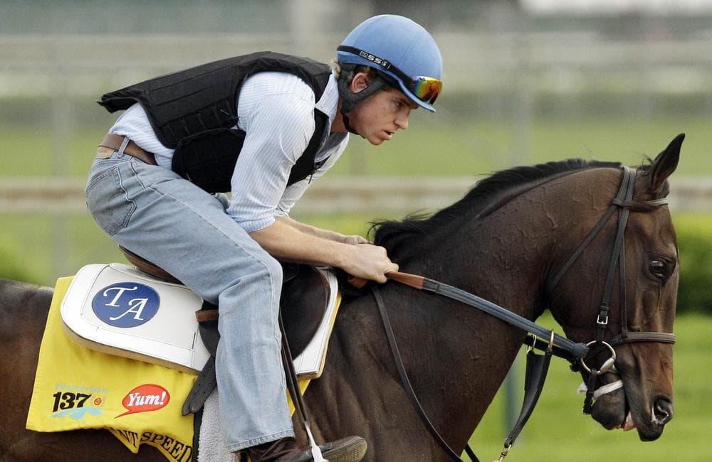 Exercise rider Dan Blacker takes Kentucky Derby Brilliant Speed for a workout at Churchill Downs. (AP)