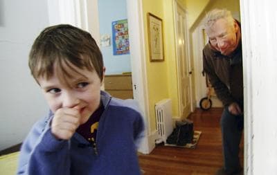 In this January 2011 still photo taken from video, PBS newsman Robert MacNeil, right, plays with Nick, his 6-year-old grandson, at Nick's family's home in Cambridge, Mass. (AP)