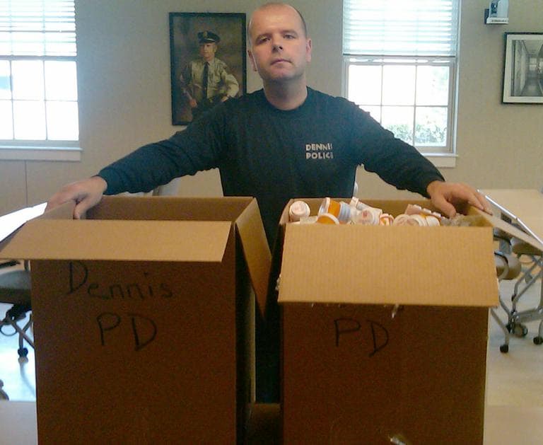 Dennis Police Sgt. Cleve Daniels collected hundreds of pounds of unused prescription drugs during National Prescription Drug Takeback Day on April 30. (Deborah Becker/WBUR)